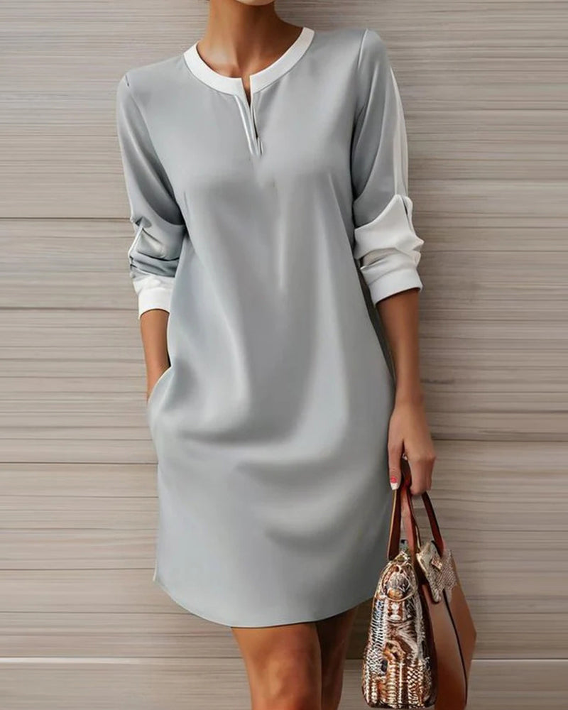 Elegant dress with round neck and V-neckline