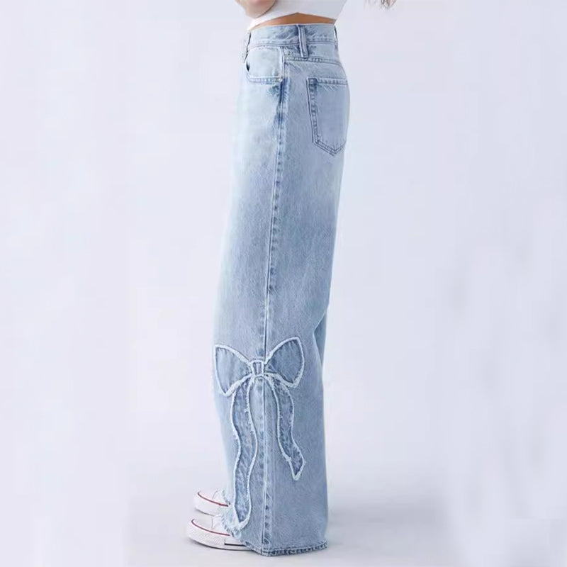 Chic jeans with embroidery and bows