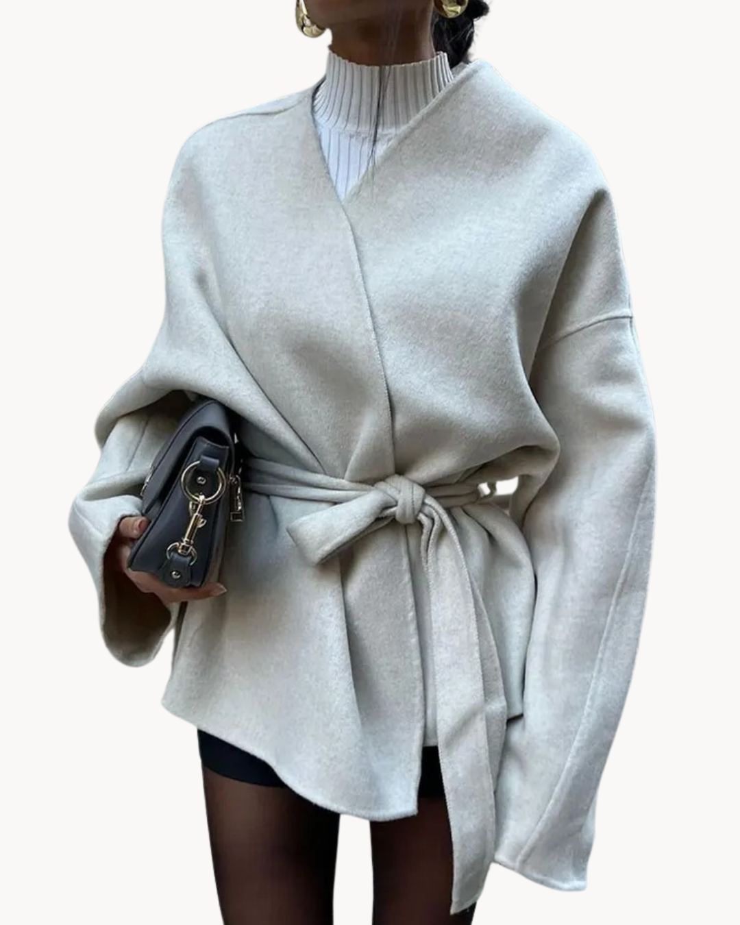 Elegant women's jacket with waist and belt detail
