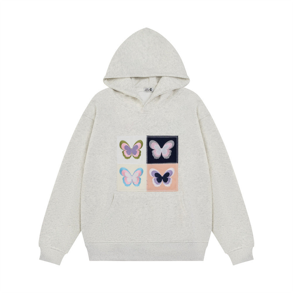Elegante Frauenkleidung mit Stickerei Schmetterling