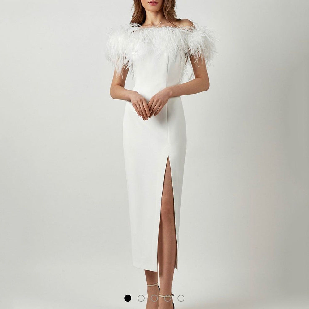 Elegant evening gown with feather lace and a figure-hugging cut