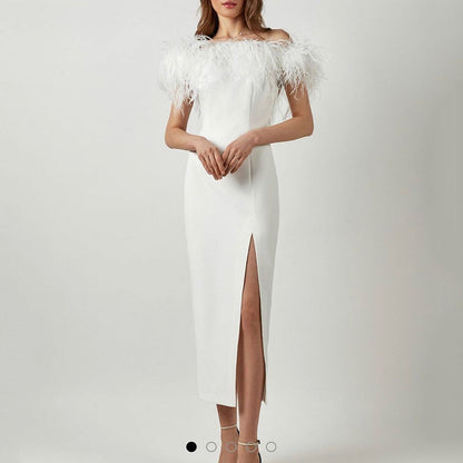 Elegant evening gown with feather lace and a figure-hugging cut