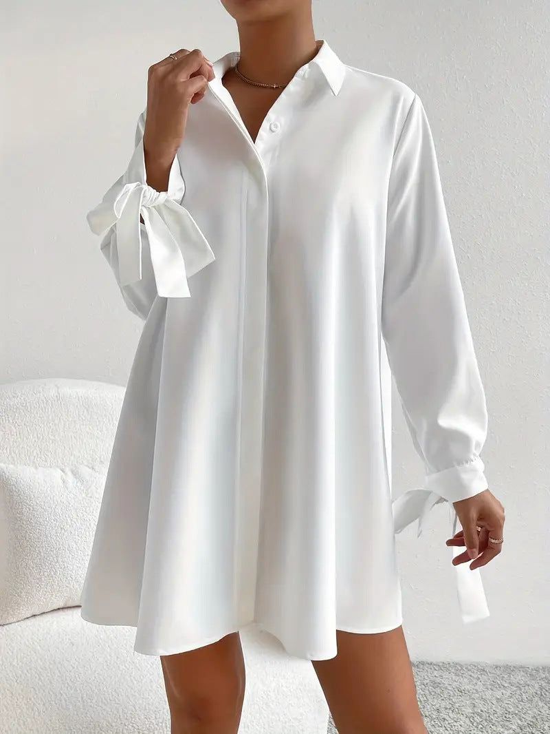 Elegant women's dress with ruffled sleeves and ties