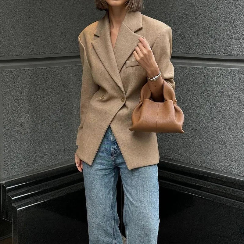 Fashionable women's blouse made of synthetic fibers with a wide linen look