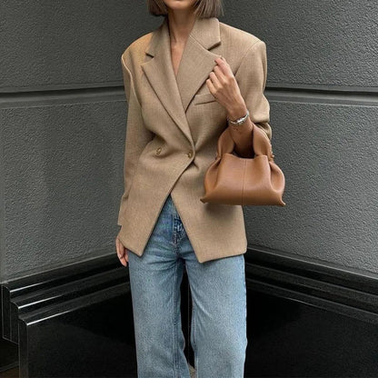 Fashionable women's blouse made of synthetic fibers with a wide linen look