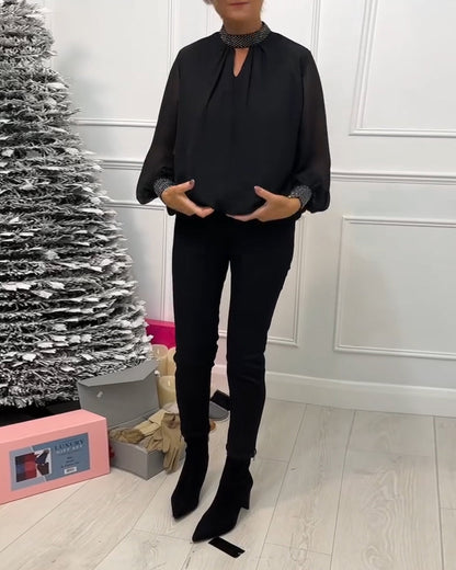 Elegant blouse with stand-up collar and color-block neckline
