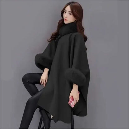 Elegant women's cape jacket with faux fur trim