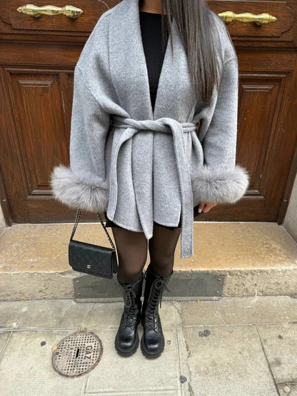 Stylish wool coat with belt and faux fur details