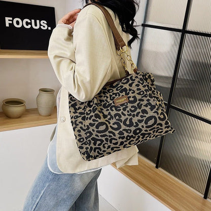 Stylish leopard print bag with faux leather handles