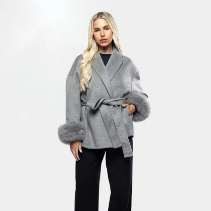 Elegant wool jacket with belt and faux fur cuffs