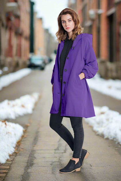 Waterproof knee-length rain jacket with hood